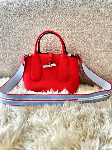 Red/Pinkish Longchamp leather crossbody handbag with detachable striped strap