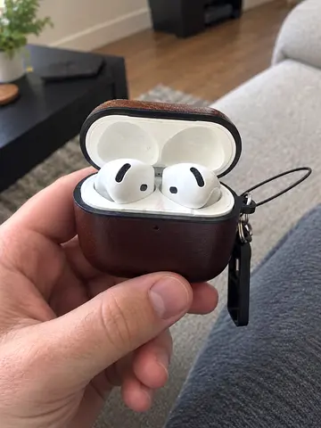 Apple AirPods 4th Gen ANC with brown protective case