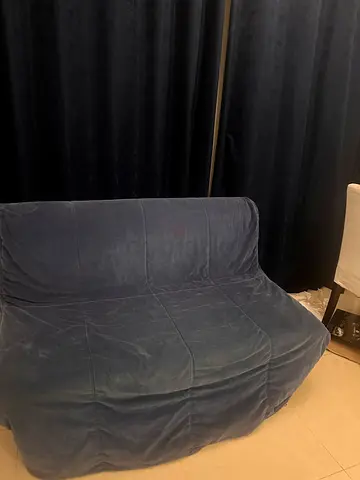Compact 2-seater blue fabric sofa (TURNS INTO BED) - good condition