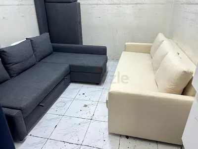 Two sofas - cream 3-seater and dark gray L-shape chaise (used)