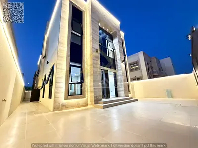 New villa on a corner lot with a roof terrace, prime location near Sheikh Ammar Street and Al-Talla