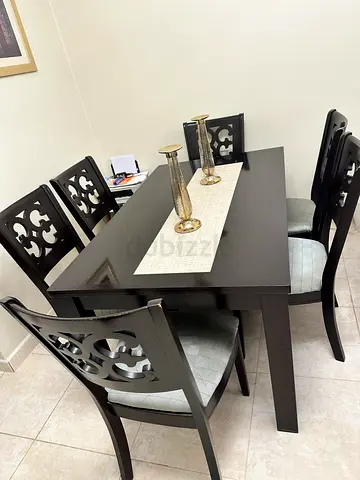 Sale of dark wooden dining table with 6 carved chairs - good condition