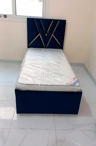 Single upholstered bed with mattress - navy velvet, storage base