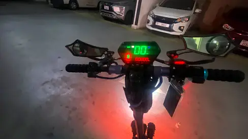Well-maintained electric scooter (handlebar view) — ready to ride