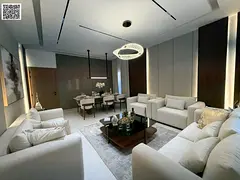 A modern villa in Al Helio, near Safir Hypermarket and the Dubai exit. It features a built-up area o