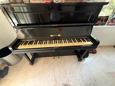 A vintage upright British piano made by W. H. Barnes Ltd - Classic Black, needs tuning