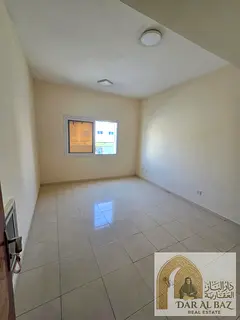 A one-bedroom apartment with a living room is available for annual rent in the Muwaileh area of 