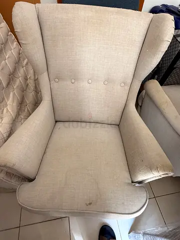 Beige Upholstered Armchair with Wingback Design - Used