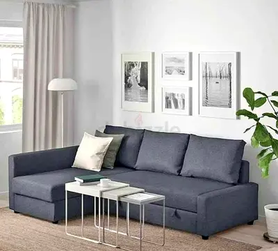 L-shaped grey fabric sofa bed with chaise lounge  good condition