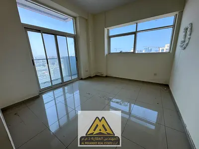 Spacious apartment for annual rent in Ajman Industrial Area | 3 bedrooms, living room, and maid's room | Central air conditioning and 2 free parking s
