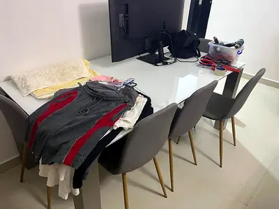 White glossy dining table with 6 modern grey chairs - good condition