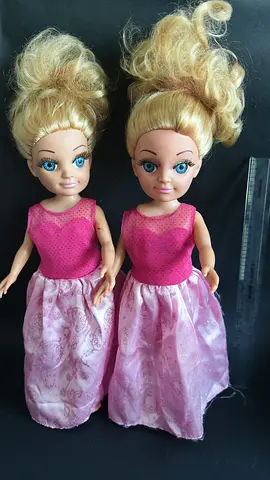 Pair of used blonde dolls in pink dresses — good for play or repair