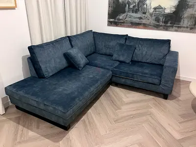 Dark green L-shaped sofa with chaise, good condition