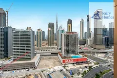 2BR Apartment | ENI Coral Tower | Balcony | Burj & Canal View