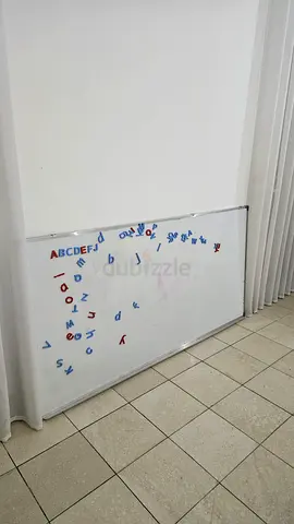 Large magnetic whiteboard with alphabet magnets - used ( 90 aed EACH)