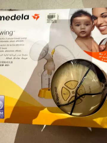 Medela single breast pump with some free accessories