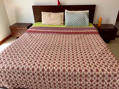 King size wooden bed frame with storage drawers and matching side tables