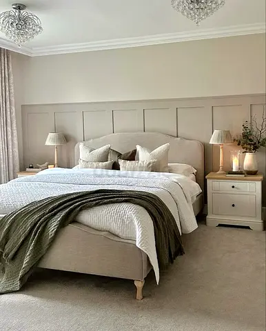 Beige upholstered double bed with headboard and wooden leg