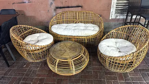 Rattan outdoor lounge set — 2 chairs, loveseat and coffee table with cushions