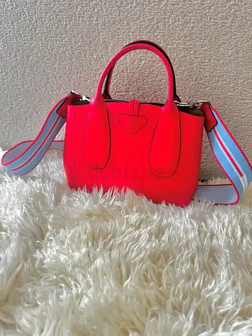 Red/Pinkish Longchamp leather crossbody handbag with detachable striped strap