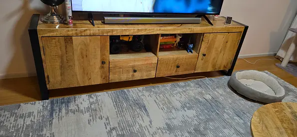 Solid wood-look TV cabinet with storage - good condition.