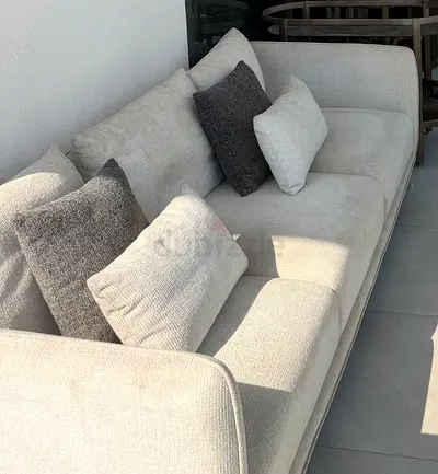 Beige 3-seater sofa with cushions - good condition