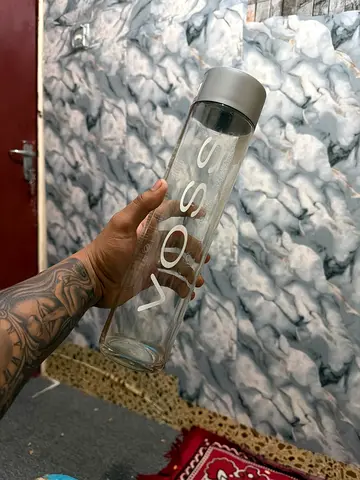 Clear glass water bottle with white lid — 1L (lightly used)