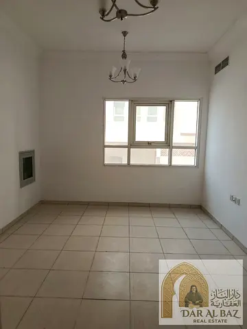 A one-bedroom apartment with a living room is available for annual rent in the Al Majaz area of Sharjah. This distinctive apartment features a spaci