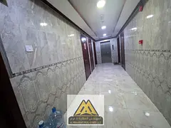 One-bedroom apartment with a living room and central air conditioning; prime location in Al Rawda 1.