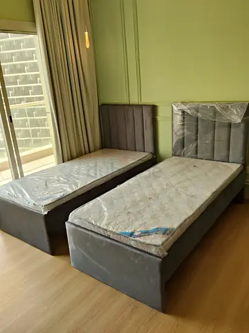 Pair of single beds with mattresses - good condition