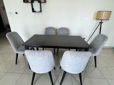 6-seater modern dining table with grey upholstered chairs