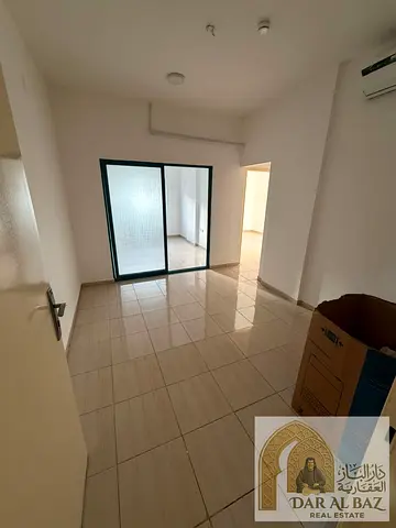 A two-bedroom apartment with a living room is available for annual rent in Al Qasimia (Al Nad), Sharjah. It features high-end finishing, an elegant de