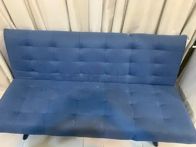 Blue fabric sofa bed / futon - good working condition