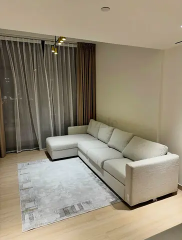 L-shaped fabric sofa in excellent condition 4 seater
