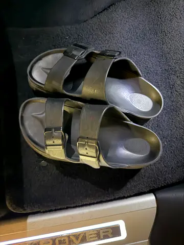 Pre-owned black double-strap slip-on sandals, size unknown - good condition