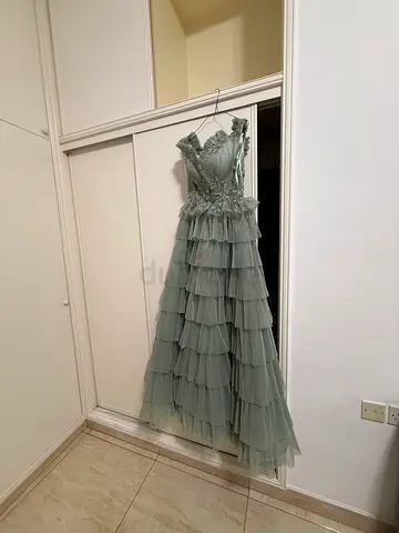 Light green off shoulder party gown