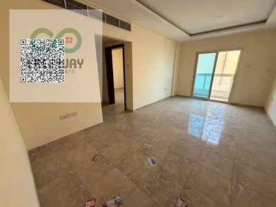 For annual rent in Ajman: 2 bedrooms and a living room in Al Rawda 1, featuring a balcony, 2 bathrooms, and excellent spaciousness.