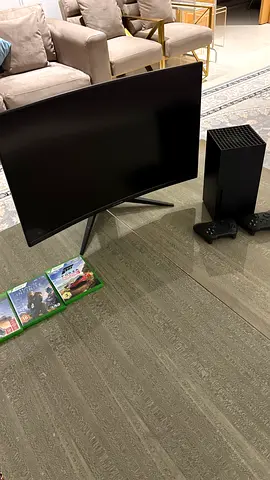 Xbox series X, with gaming monitor, 2 controllers, and games.