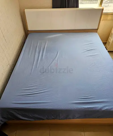 King size wooden bed frame with headboard - light oak and mattress.