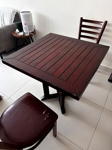 Dark wood dining table with 2 matching chairs