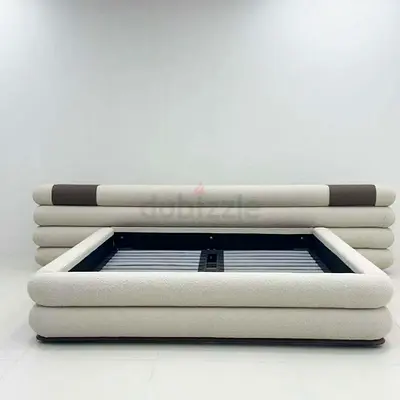Modern upholstered platform bed frame with rounded headboard - King