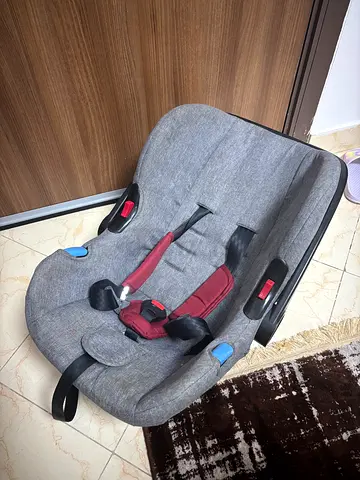 Used infant car seat - Gray with red harness, good condition
