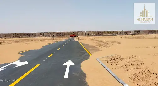 Residential land for sale in Sharjah, Rawdat Al Qurt area. A prime location opposite the Al Suyoh area.