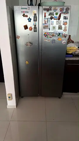 Side-by-side stainless steel refrigerator/freezer - well maintained