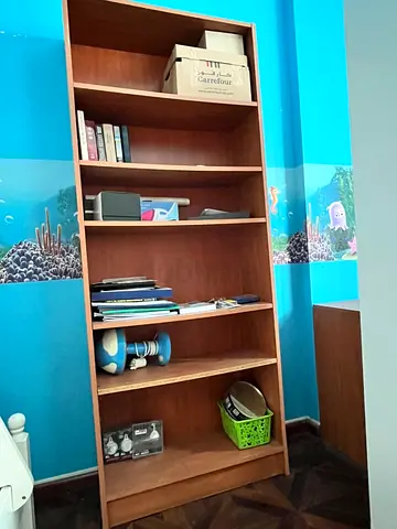 Tall wooden bookcase / bookshelf - good condition
