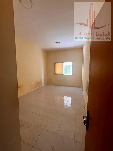 1-bedroom apartment for AED 22,000 yearly, with central AC, family building, landlord-covered maintenance and flexible payments near Jaber Al Sabah