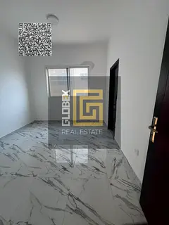 Spacious two-bedroom apartment with a living room for annual rent in Al Rawda.