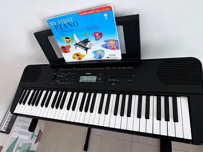 Yamaha 61-Key Electronic Keyboard with Stand & Beginner Book