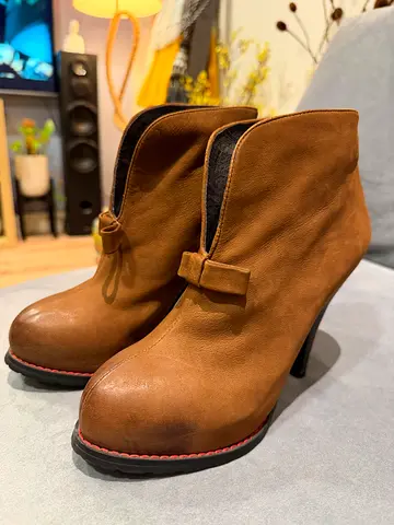 Chic Leather Heeled Ankle Boots with Accent Bow Detail