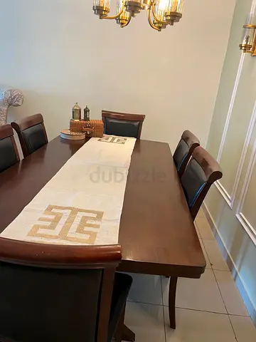 Wooden dinning table of six leather chair